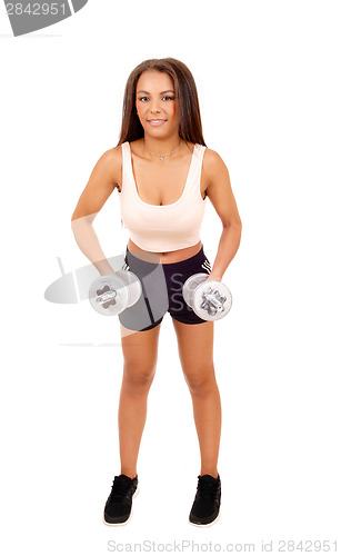 Image of Woman lifting dumbbell's.