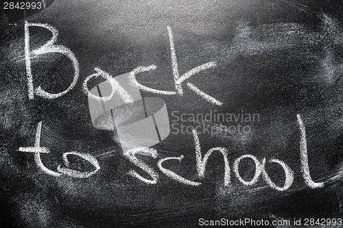 Image of Handwritten message on chalkboard writing message Back to school