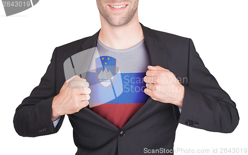 Image of Businessman opening suit to reveal shirt with flag