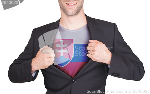 Image of Businessman opening suit to reveal shirt with flag