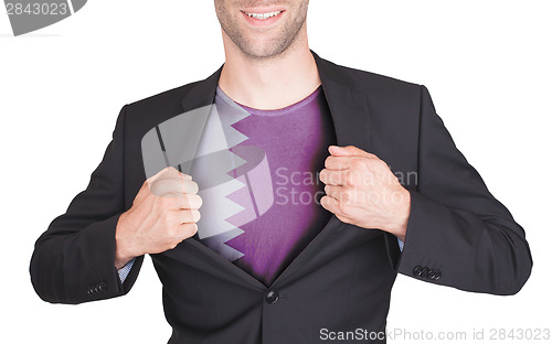 Image of Businessman opening suit to reveal shirt with flag