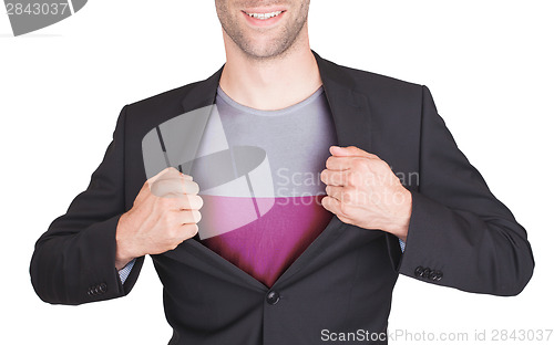 Image of Businessman opening suit to reveal shirt with flag