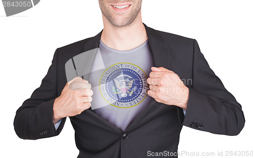 Image of Businessman opening suit to reveal shirt