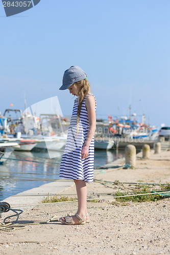 Image of Portrait of a beautiful girl in harbor