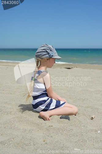 Image of Blonde little girl on the beach