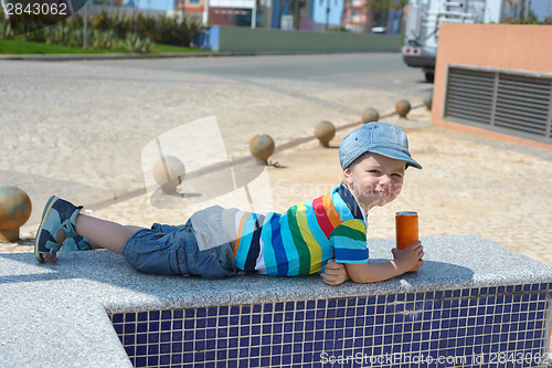 Image of Cute happy little boy with drink