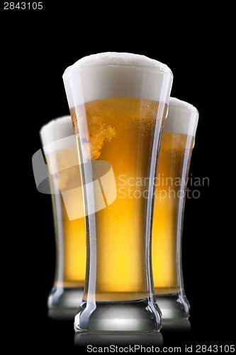 Image of Beer in glass isolated on black