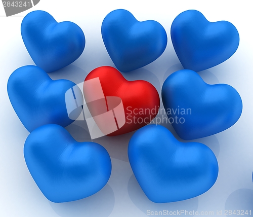 Image of One red heart standing out in crowd 