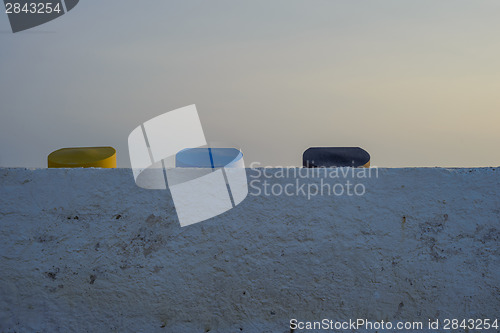 Image of Colorful containers covers, sunset