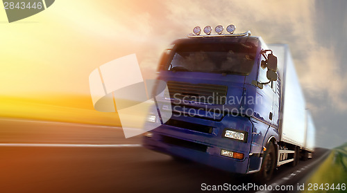 Image of truck driving at dusk/motion blur