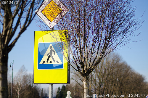 Image of road sign pedestrian crossing and intersection  