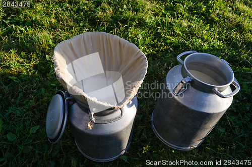 Image of milk churn with filter material  