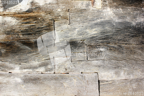 Image of old wood beams on exterior wall