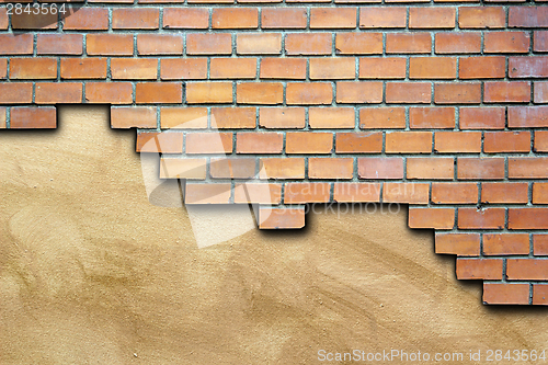 Image of cracked surface of brick wall