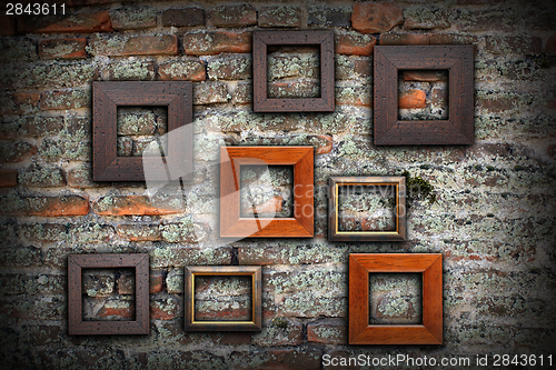 Image of grungy old wall full of wooden frames