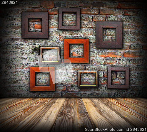Image of frames on weathered wall