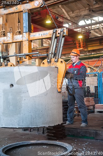 Image of Worker moves prepared unit to warehouse