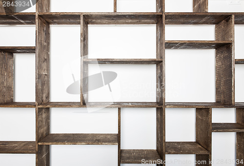 Image of Rustic style shelves on white wall