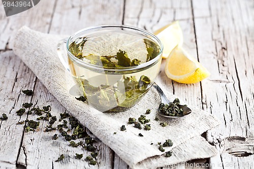 Image of cup of green tea and lemon 