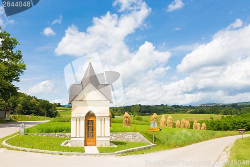 Image of Traditional hay stacks on the field.