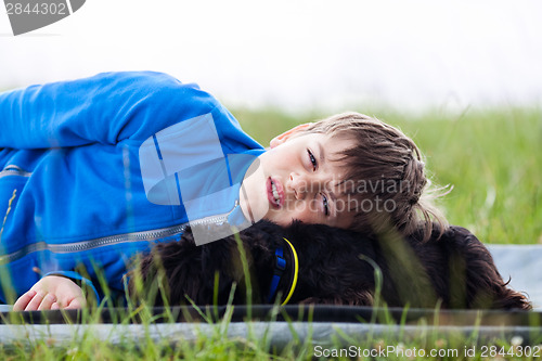 Image of Young boy with dog