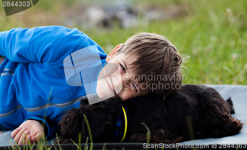 Image of Young boy with dog