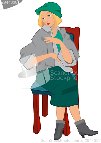Image of Retro girl sitting on the chair in green hat isolated