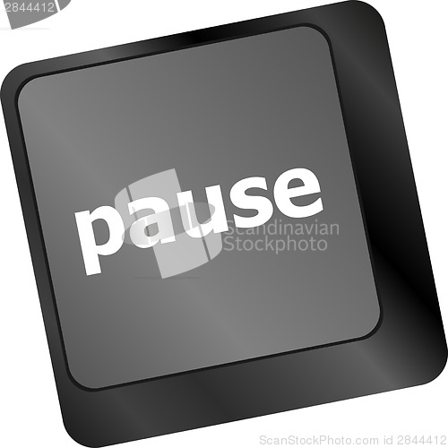 Image of Computer keyboard with pause key - business concept