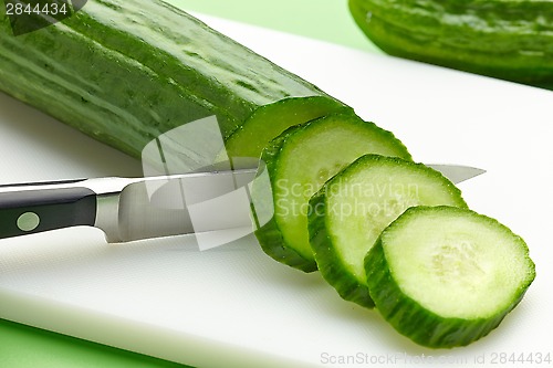 Image of fresh cucumber on cutting board