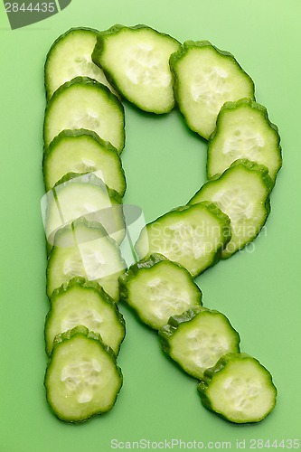 Image of R letter made of raw cucumber