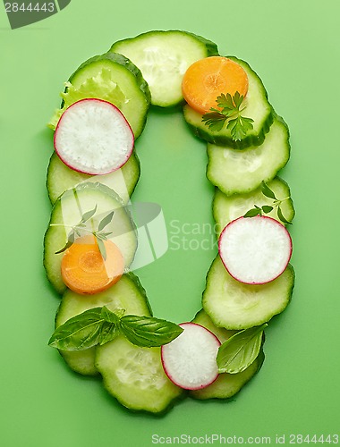 Image of O letter made of raw vegetables