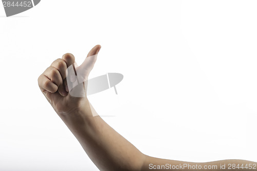 Image of Young hands making hitchhiking sign