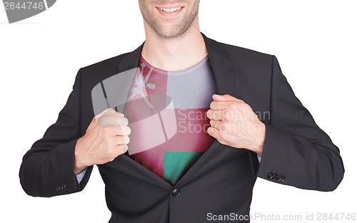 Image of Businessman opening suit to reveal shirt with flag