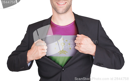 Image of Businessman opening suit to reveal shirt with flag