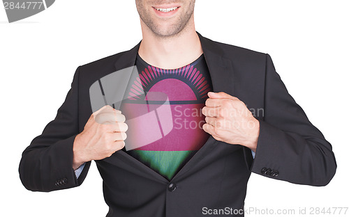 Image of Businessman opening suit to reveal shirt with flag