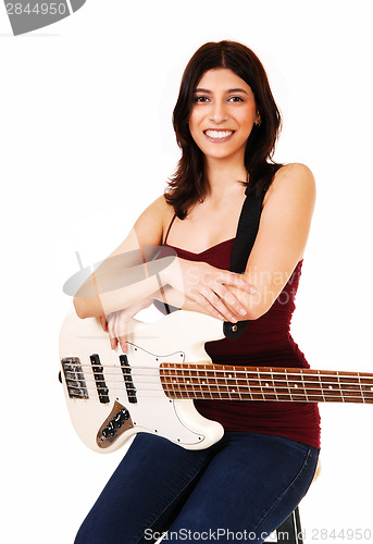 Image of Sitting woman with guitar.