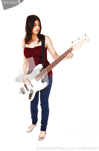 Image of Woman playing guitar.