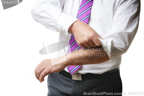 Image of Business Man rolls up sleeves