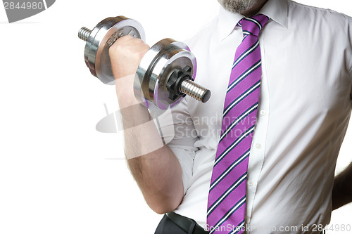 Image of Businessman holding silver dumbbell