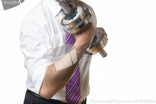 Image of Businessman holding silver dumbbell