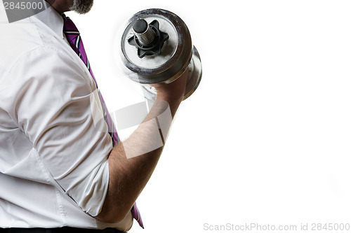 Image of Businessman holding silver dumbbell