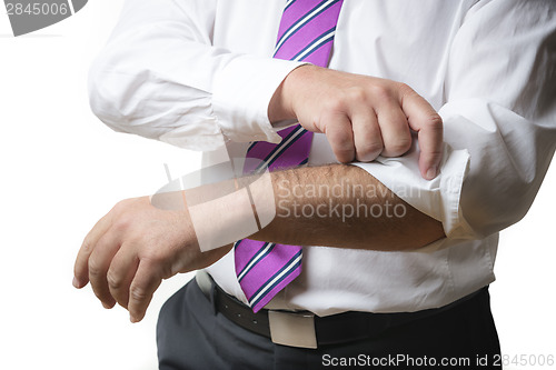 Image of Business Man rolls up sleeves