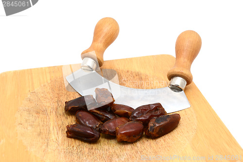 Image of Whole dates with a rocking knife 