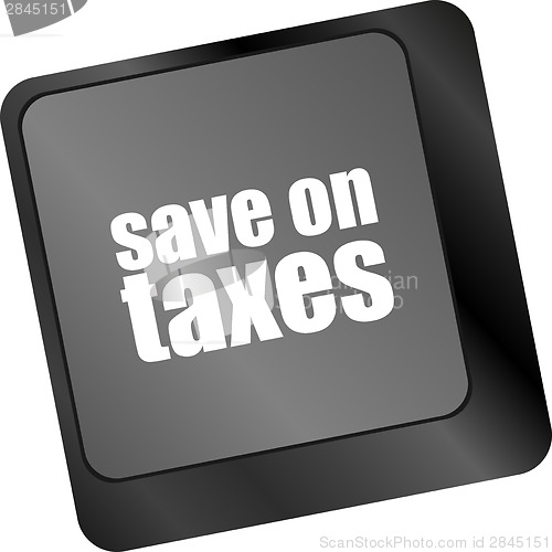 Image of save on taxes word on laptop keyboard key, business concept