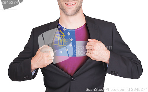 Image of Businessman opening suit to reveal shirt with state flag