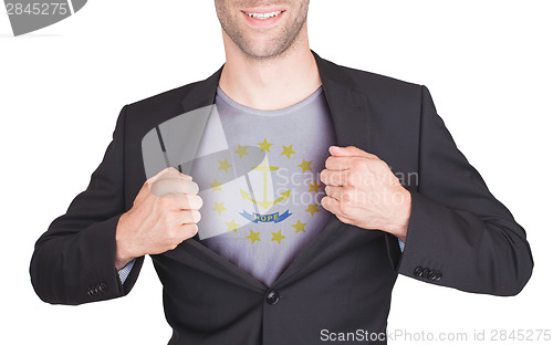 Image of Businessman opening suit to reveal shirt with state flag