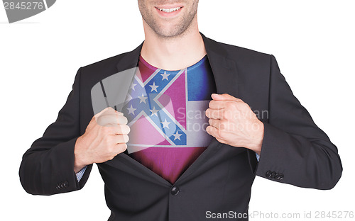 Image of Businessman opening suit to reveal shirt with state flag