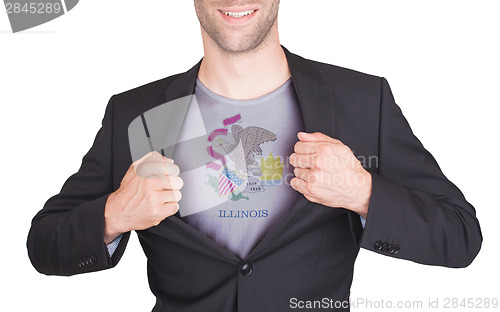 Image of Businessman opening suit to reveal shirt with state flag
