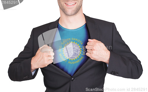 Image of Businessman opening suit to reveal shirt with state flag