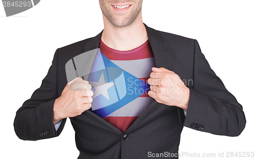 Image of Businessman opening suit to reveal shirt with state flag